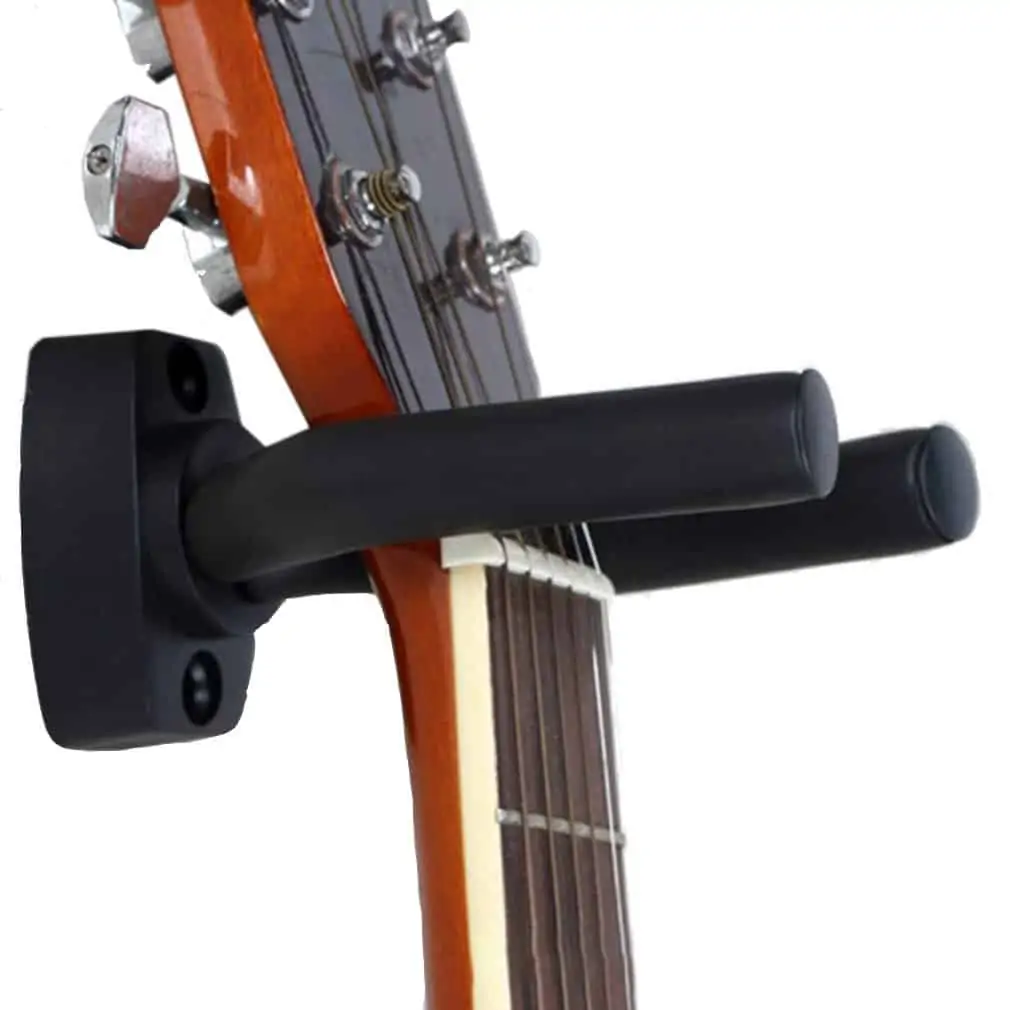 A guitar suspended and stored using a guitar hanger