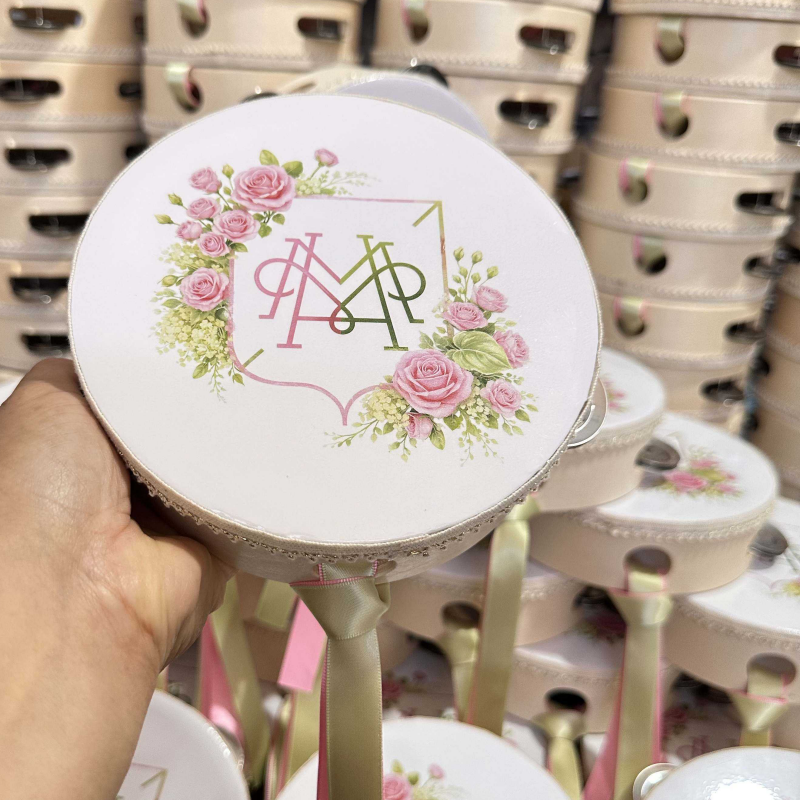 4 inch mini tambourines arranged with wedding flowers and cards